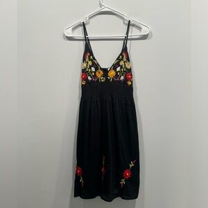 Ocean breeze dress size small. Black with cute red floral pattern